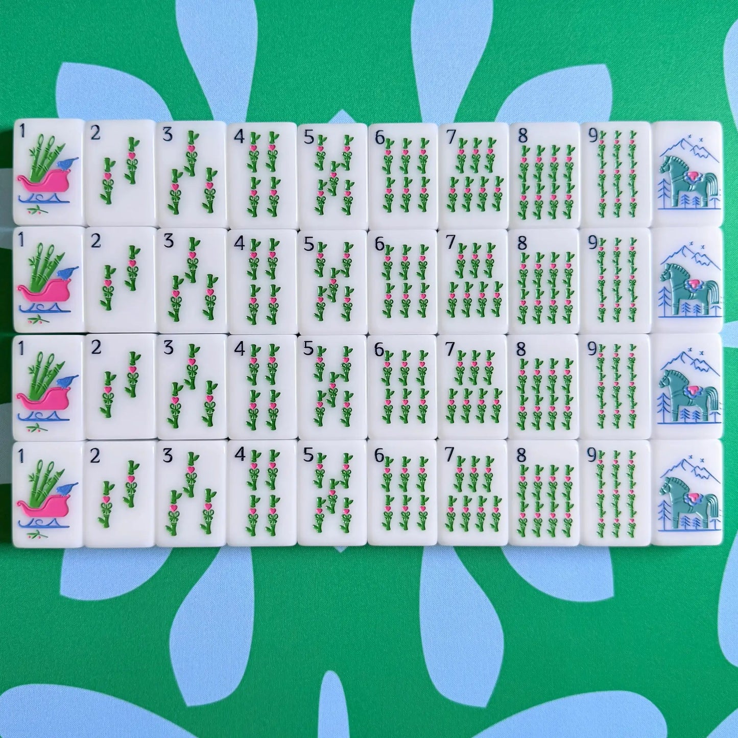 The Scandinavian Christmas Mahjong Collection's bams and green dragons displayed as they come packaged.
