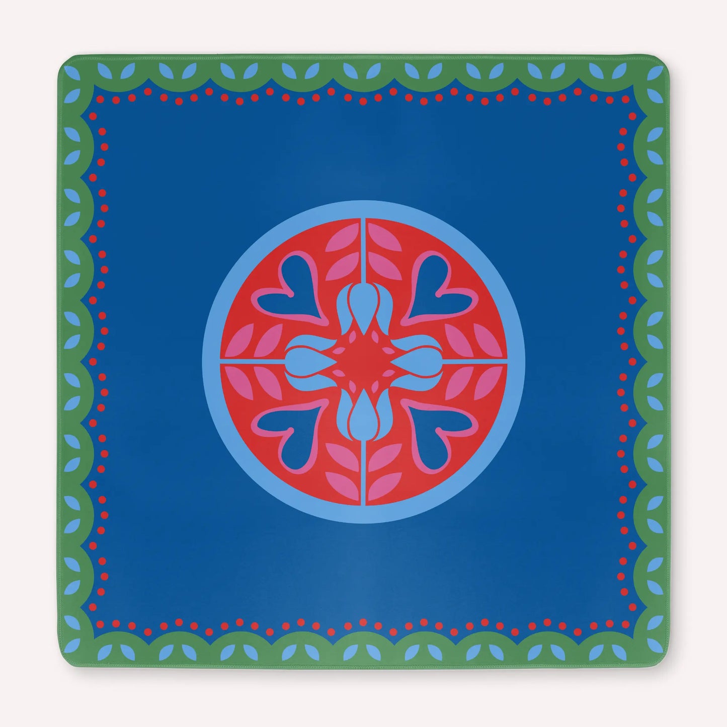 Mockup of a luxury Hearts & Flowers mahjong mat featuring vivid azure and red tones with soft gray green details and subtle pink accents, designed in a bright floral and holiday-inspired style.