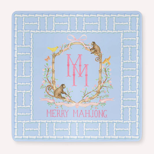Light Blue Mahjong Mat with a lattice bamboo border and the TheMerryMahjongCo Logo featuring floral elements alongside monkeys, birds and butterflies.