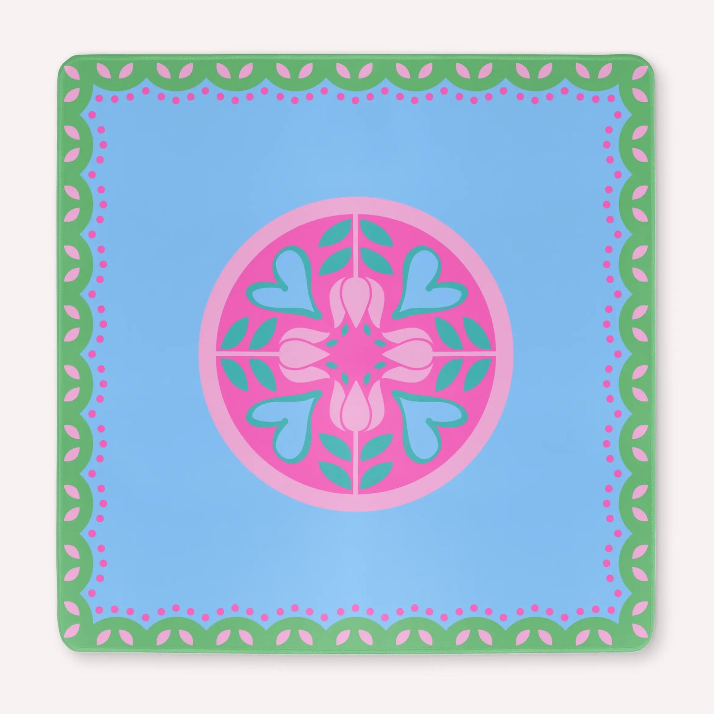 Mockup of the Hearts & Flowers mahjong mat featuring pastel azure, green, vivid magenta, light magenta, and cyan tones in a bright floral-inspired design with playful heart accents.