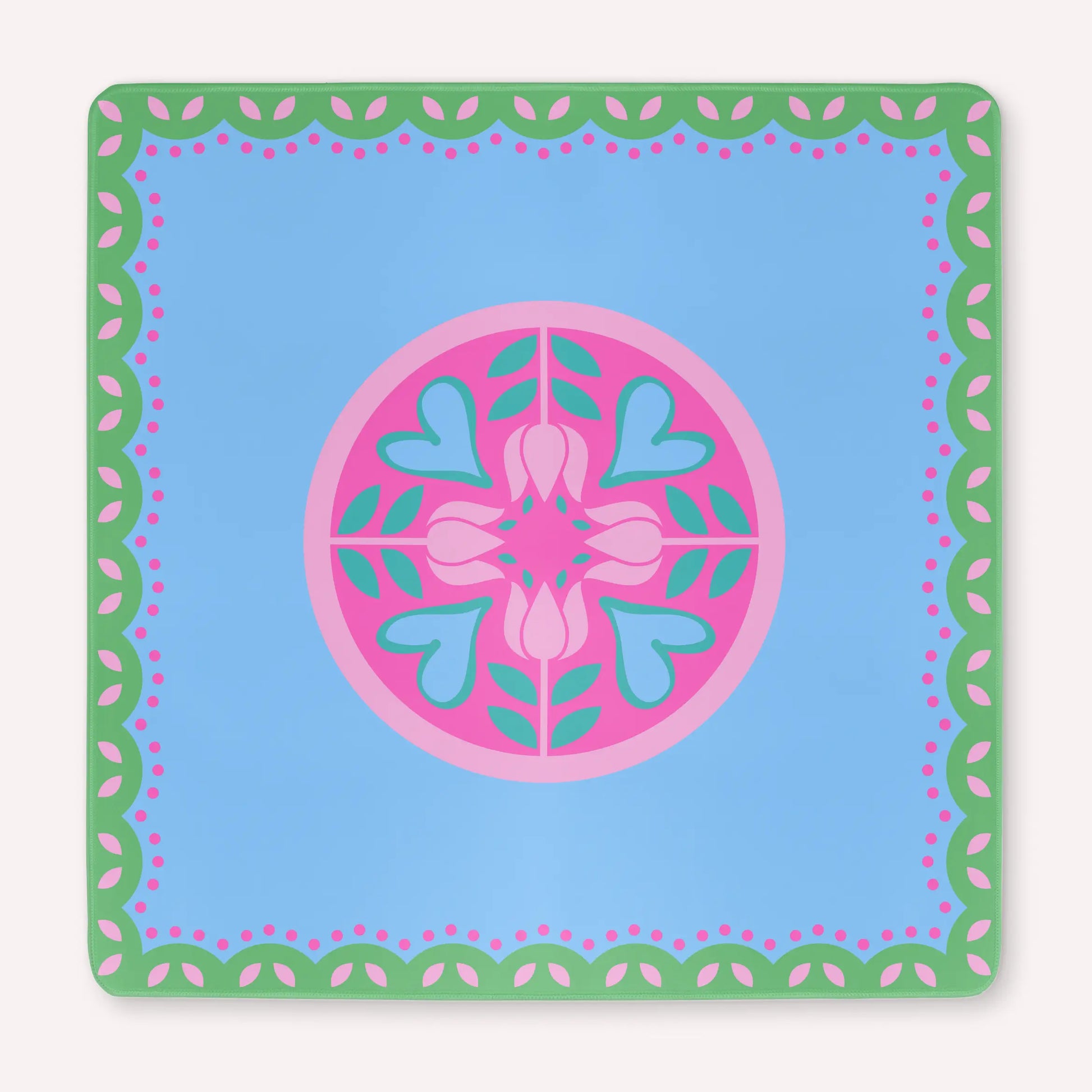 Mockup of the Hearts & Flowers mahjong mat featuring pastel azure, green, vivid magenta, light magenta, and cyan tones in a bright floral-inspired design with playful heart accents.