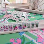 Southern Springs American mahjong tile set showing jokers, bamboo tiles (bams), and dot tiles on rack