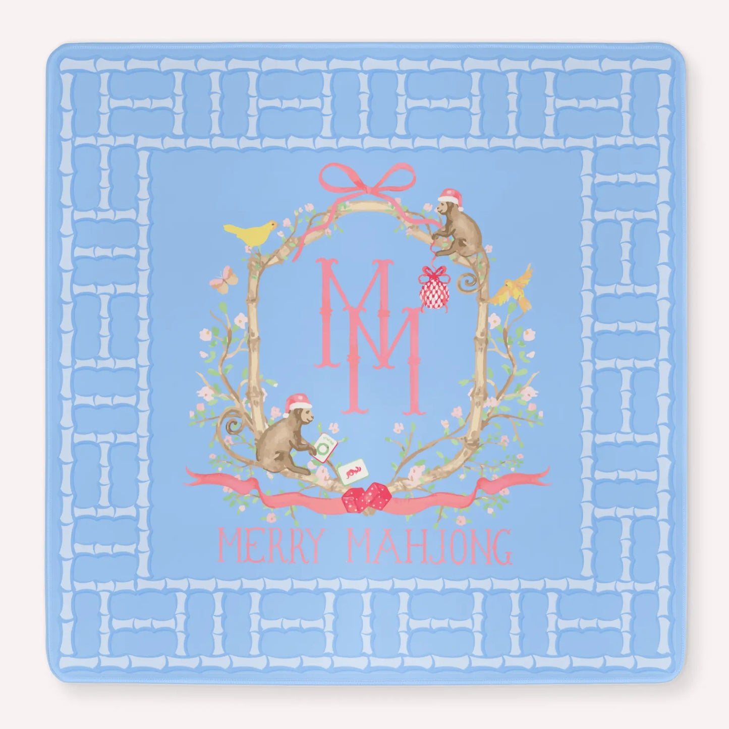 Mockup of the bamboo blossom Christmas mahjong mat, with a floral design including a bamboo lattice pattern, monkeys, leaves and flowers, birds and monkeys, Christmas ornaments and dice.