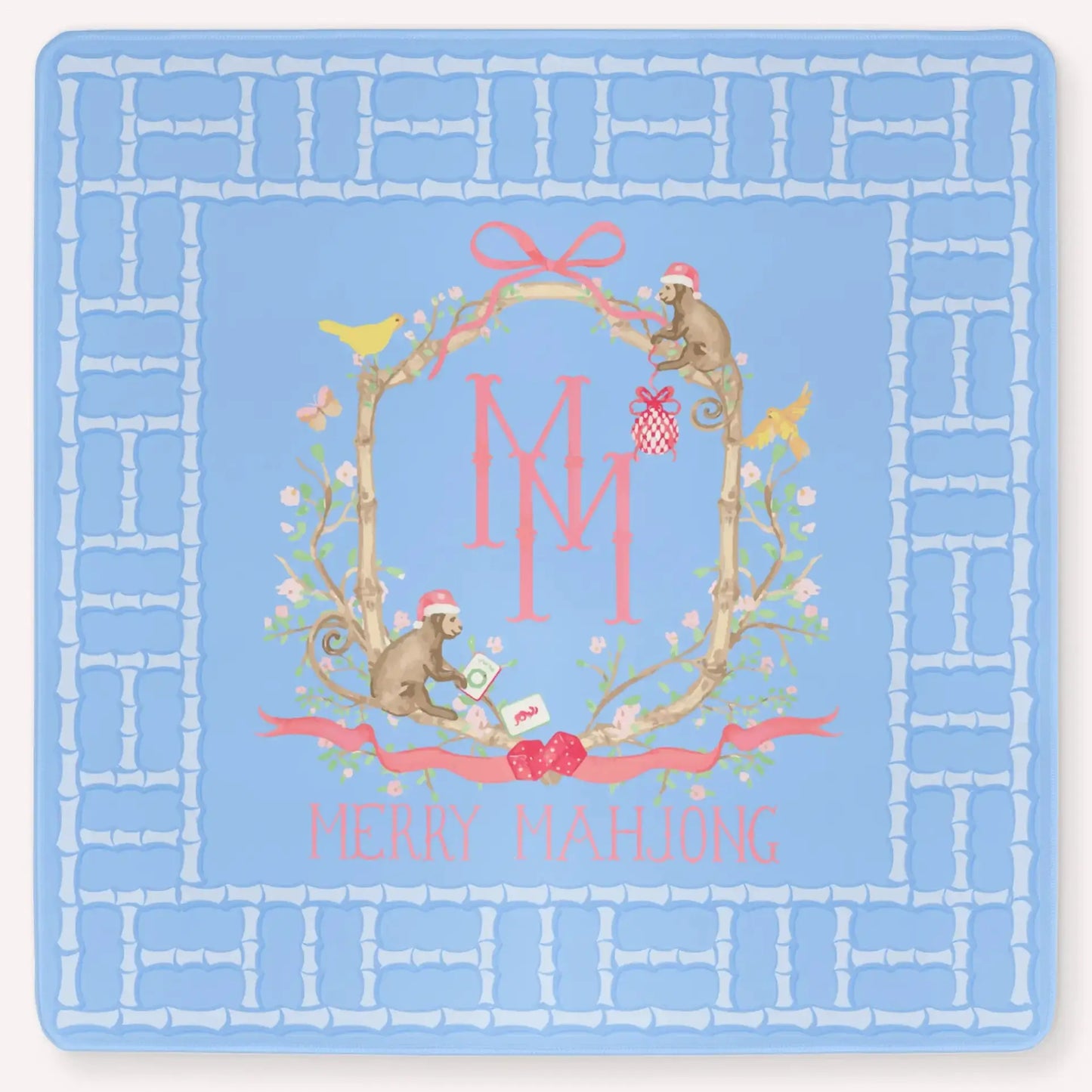 The Bamboo Blossom Christmas Edition Mahjong Mat featuring a festive bamboo lattice border design, monkeys with Christmas hats, ornaments, bows, birds, flowers and leaves with the Merry Mahjong Logo.