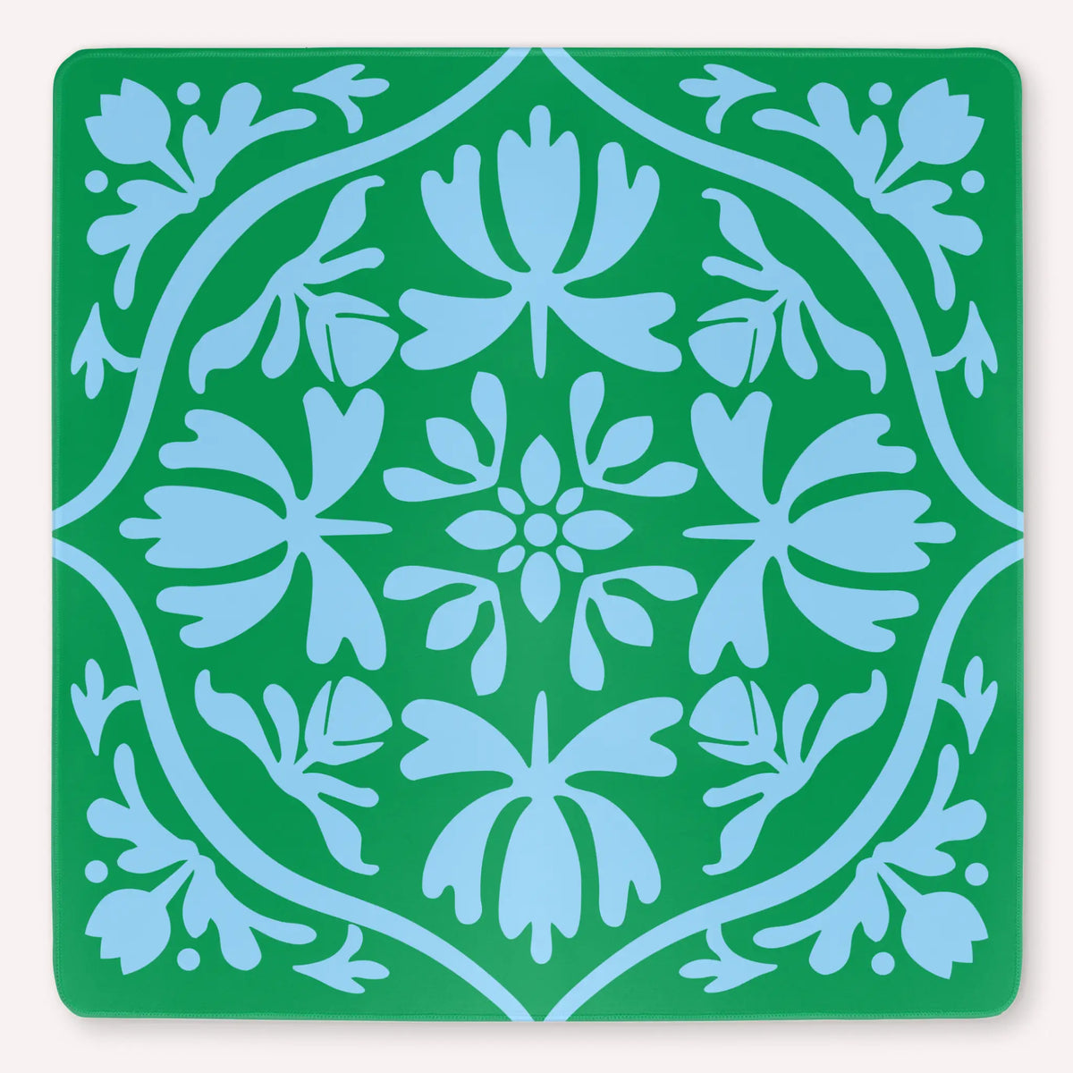 Tulip Terrace Emerald Mist Mahjong mat mockup featuring powder blue tulips on a vivid green background.