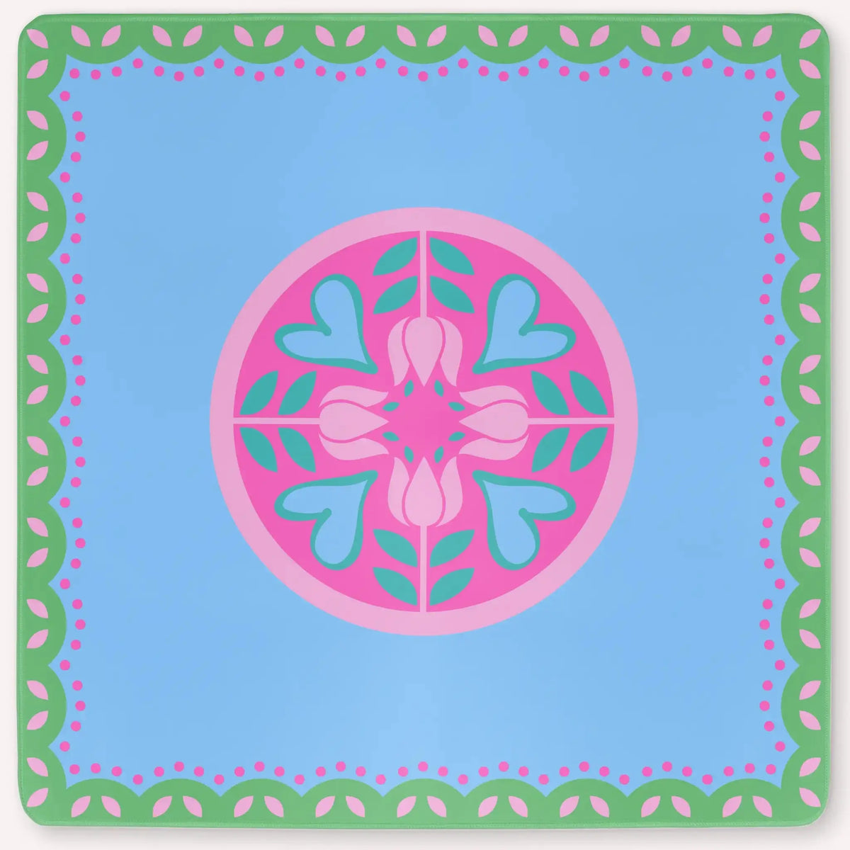 Mockup of the Hearts & Flowers mahjong mat featuring pastel azure, green, vivid magenta, light magenta, and cyan tones in a bright floral-inspired design with playful heart accents.