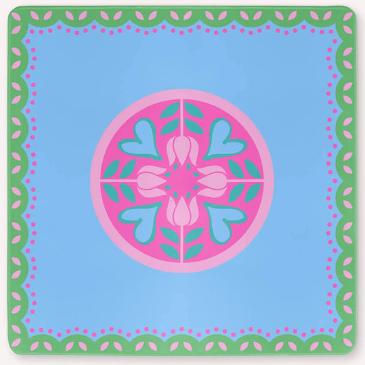 Mockup of the Hearts & Flowers mahjong mat featuring pastel azure, green, vivid magenta, light magenta, and cyan tones in a bright floral-inspired design with playful heart accents.
