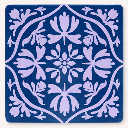Tulip Terrace Lilac Current Mahjong mat mockup featuring soft lilac tulips on a deep sea blue background.