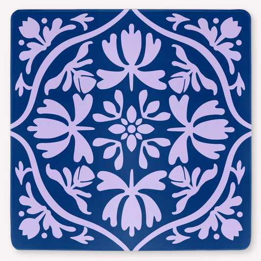 Tulip Terrace Lilac Current Mahjong mat mockup featuring soft lilac tulips on a deep sea blue background.