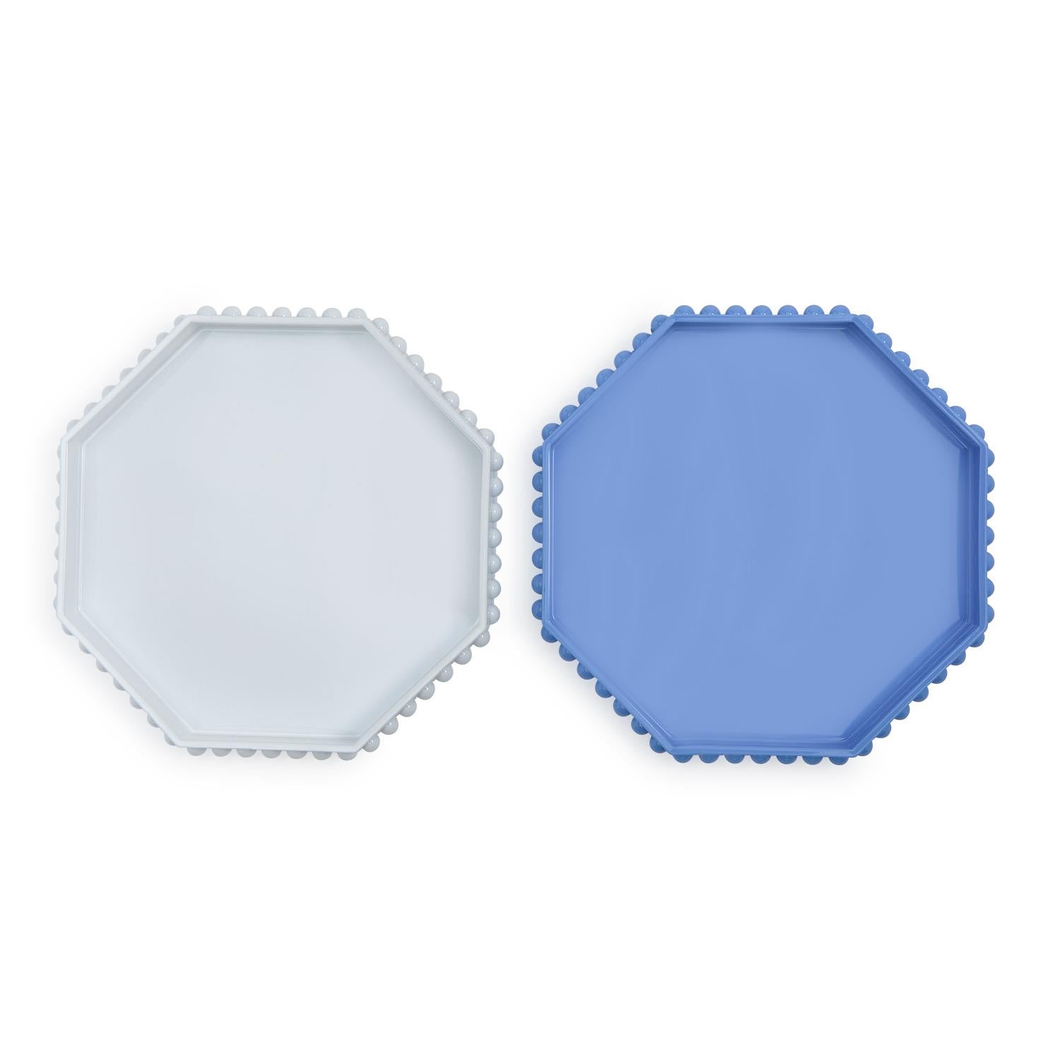 Octagonal lacquered trays with hobnail edge in blue and white side by side