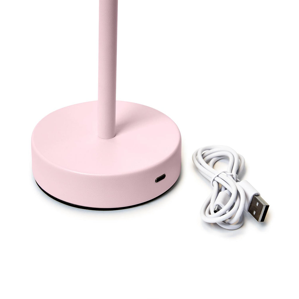 Close-up of charging port on pink cordless LED table lamp