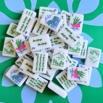 The Scandinavian Christmas Mahjong Collection's bams displayed on the Emerald Mist Mahjong Mat.