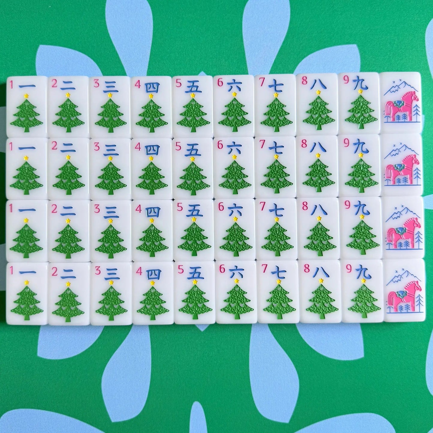 The Scandinavian Christmas Mahjong Collection's cracks and red dragons displayed as they come packaged.