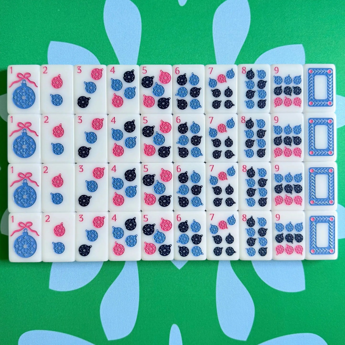 The Scandinavian Christmas Mahjong Collection's dots and white dragons displayed as they come packaged.