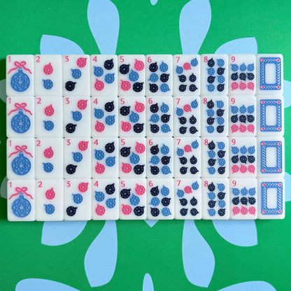The Scandinavian Christmas Mahjong Collection's dots and white dragons displayed as they come packaged.