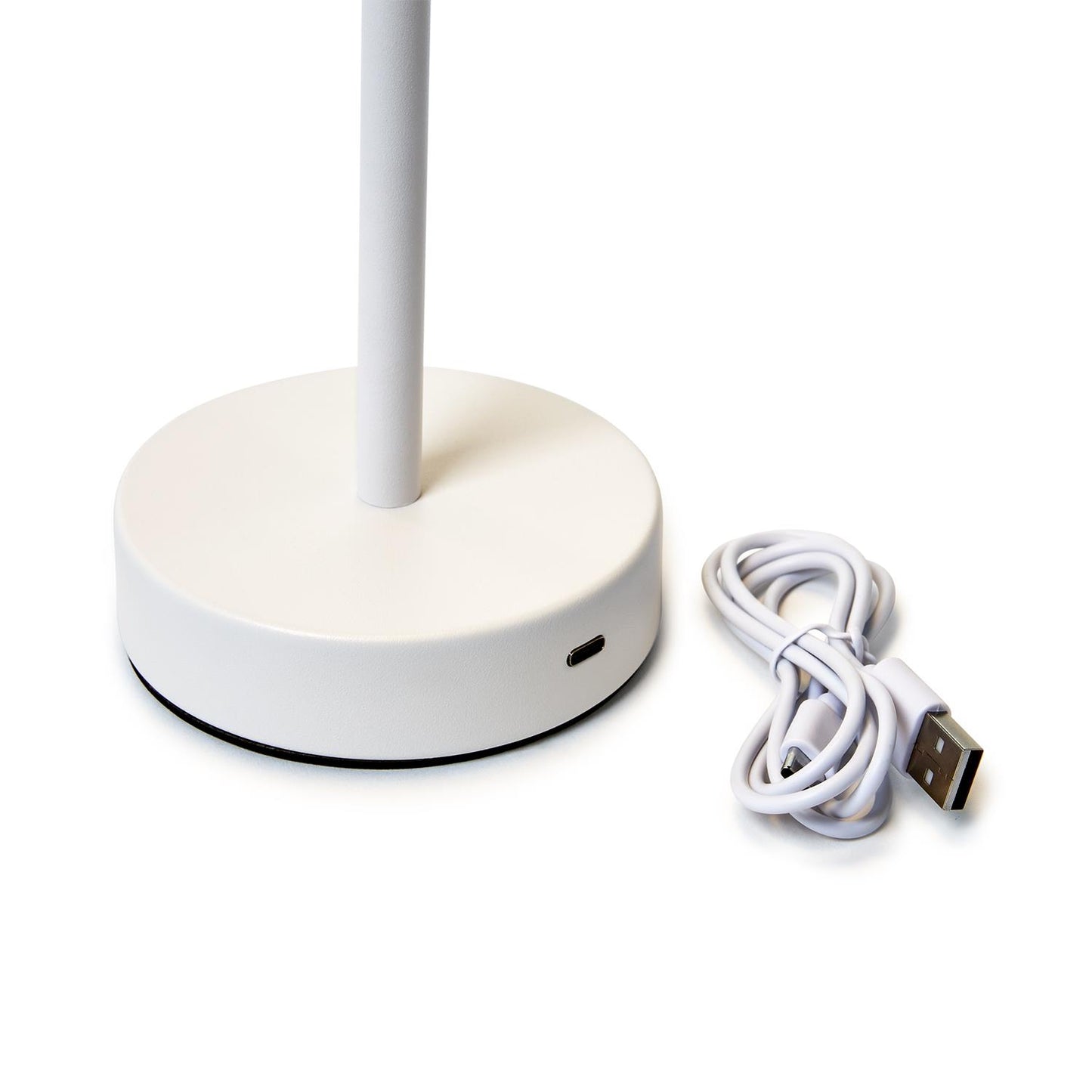 Close-up of charging port on white cordless LED table lamp