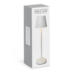 White cordless LED table lamp in retail packaging box
