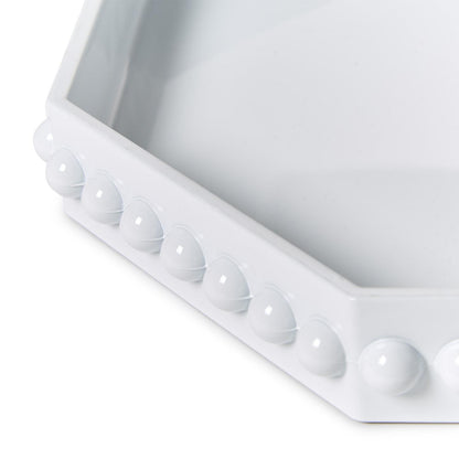 Close-up of hobnail edge detail on white octagonal lacquered tray