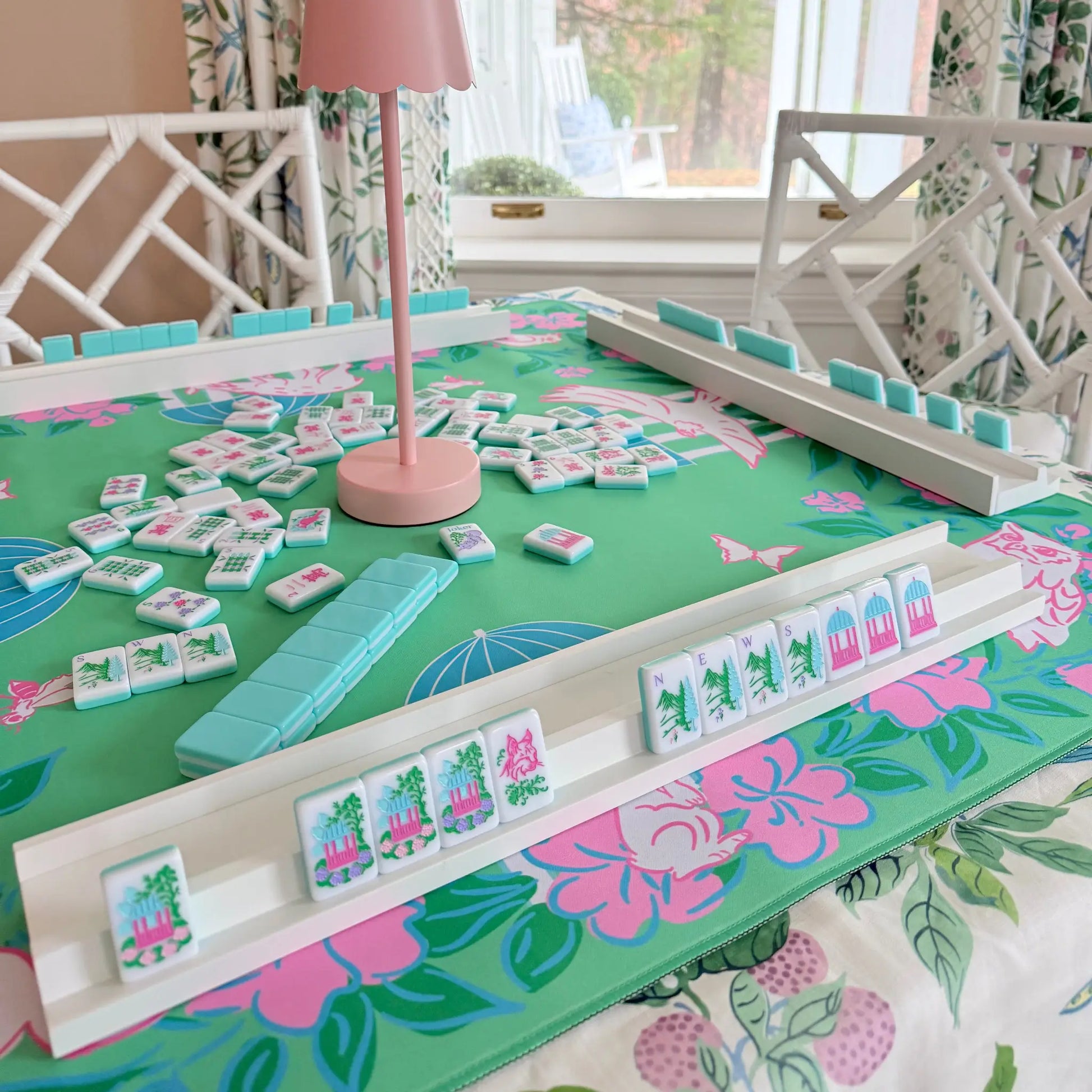White wooden racks with magnetic pushers displayed with the southern springs tile set, the southern springs mat, and the cordless pink LED lamp.